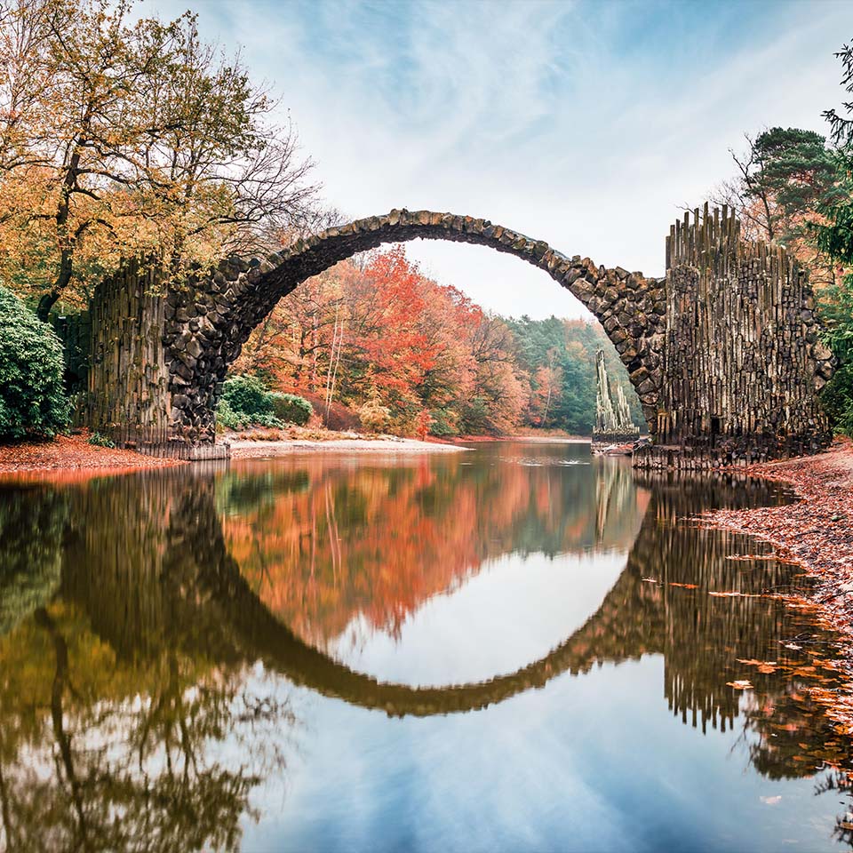 2GNEXAW - Fantastic morning scene of Azalea and Rhododendron Park Kromlau, Germany, Europe. Splendid autumn view of Rakotz Bridge (Rakotzbrucke, Devil's Bridge)