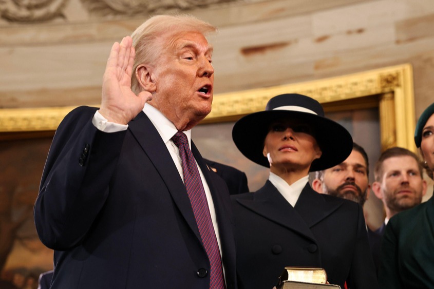 Donald Trump takes the oath of office as his wife Melania and his children look on during inauguration ceremonies in the Rotunda of the U.S. Capitol on January 20, 2025 in Washington, DC.