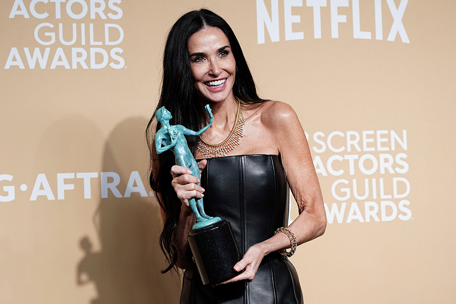 Demi Moore poses in the press room with the award for outstanding performance by a female actor in a leading role for "The Substance" during the 31st annual Screen Actors Guild Awards at the Shrine Auditorium in Los Angeles.