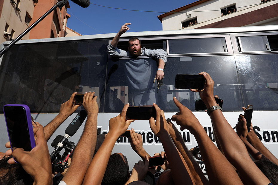 People gather to welcome Palestinians released from Israeli prisons under a Gaza ceasefire and hostage exchange deal with Palestinian factions.